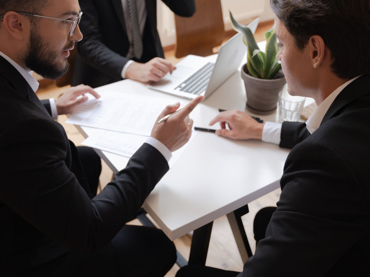 Business leaders reviewing priorities together at a meeting table